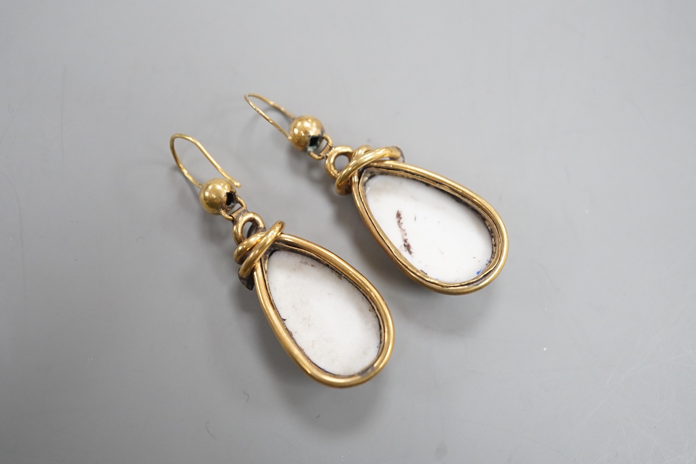 A pair of late Victorian pinchbeck and enamel drop earrings, each decorated with the bust of a lady, 34mm.